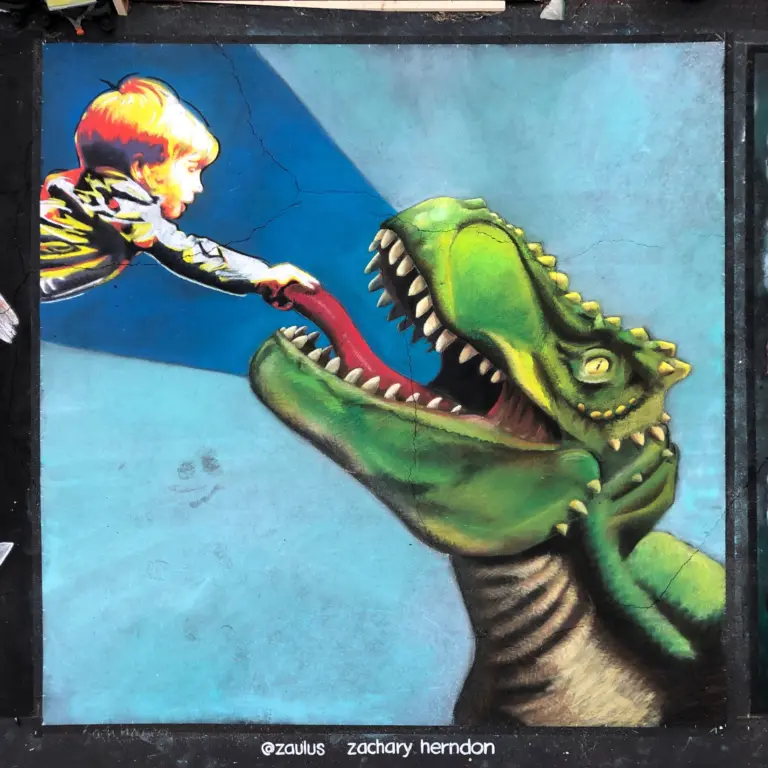 Chalk painting of a boy leaning in to feed a green T. rex that rises toward him with its mouth open, signed by Zachary Herndon.